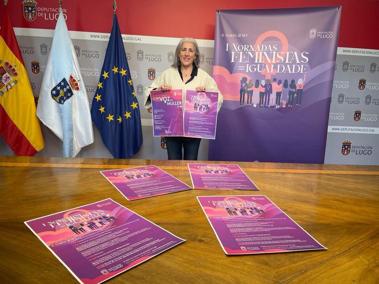 A deputada da área de Muller e Igualdade da Deputación de Lugo, Marisol Morandeira, pousa cos carteis da programación presentada pola institución provincial para conmemorar o Día Internacional da Muller. En Lugo, a 4 de marzo de 2024 / Europa Press